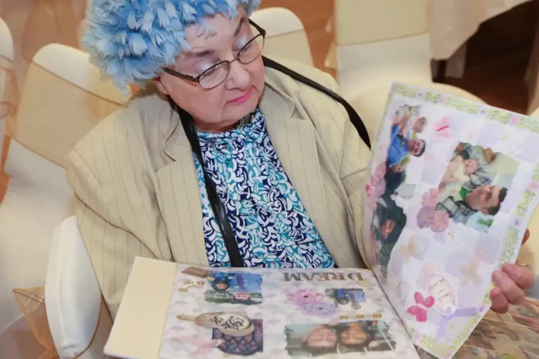 Guest looking at photos at wedding reception
