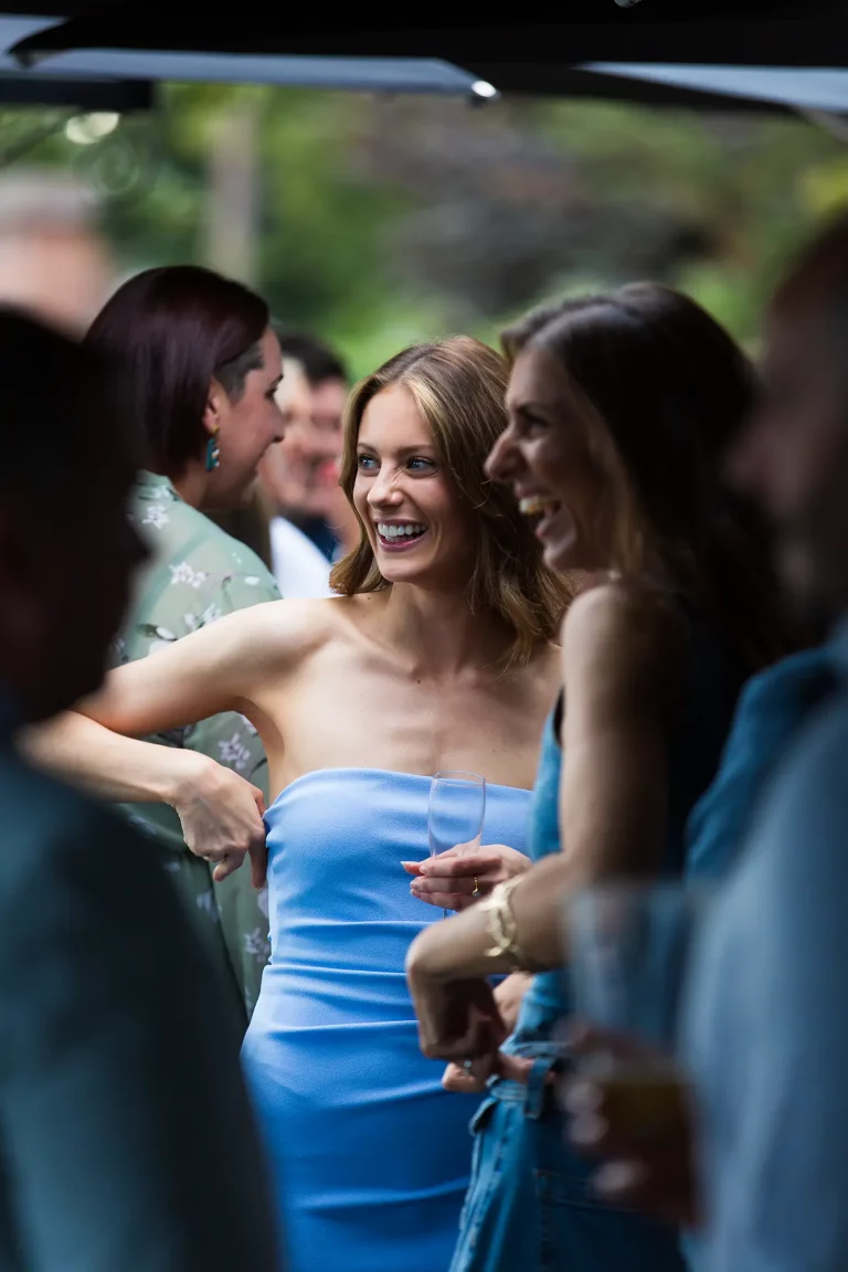 Wedding reception guests laughing