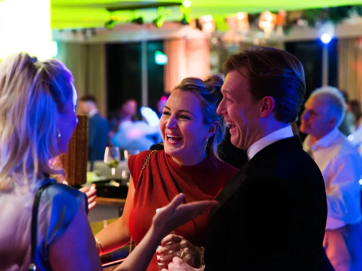 guests laughing at business event
