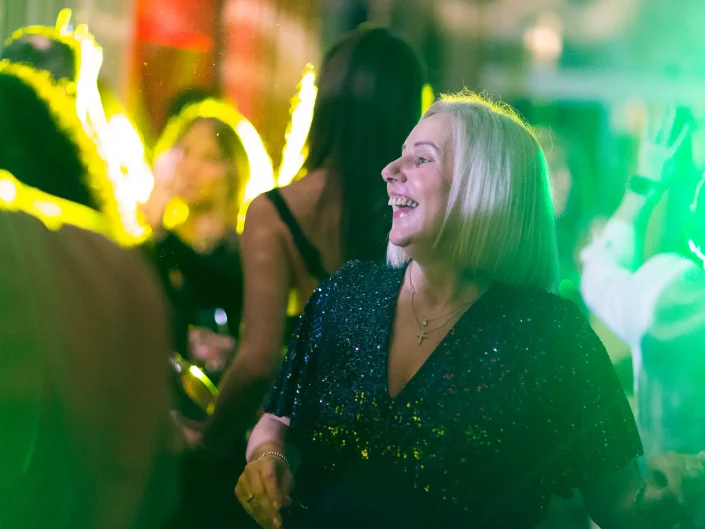 smiling event guest at business party