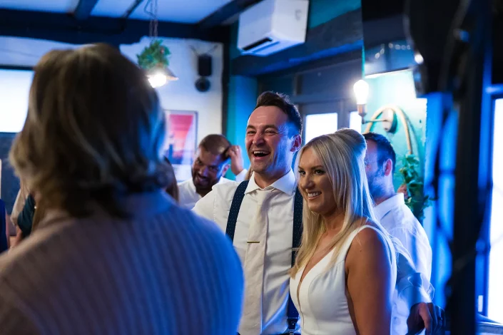 couple entering wedding reception