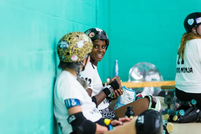 essex roller derby skater waiting bench