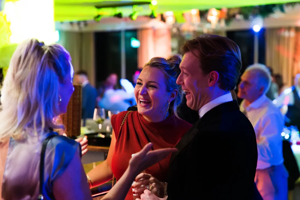essex wedding reception guests chatting at roslin hotel