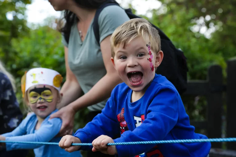 excited-child-balancing-on-rope-game