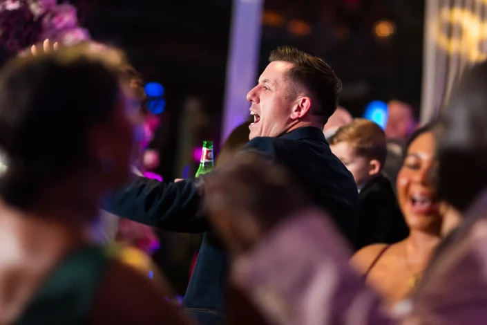 wedding guest laughing on dance floor roslin hotel