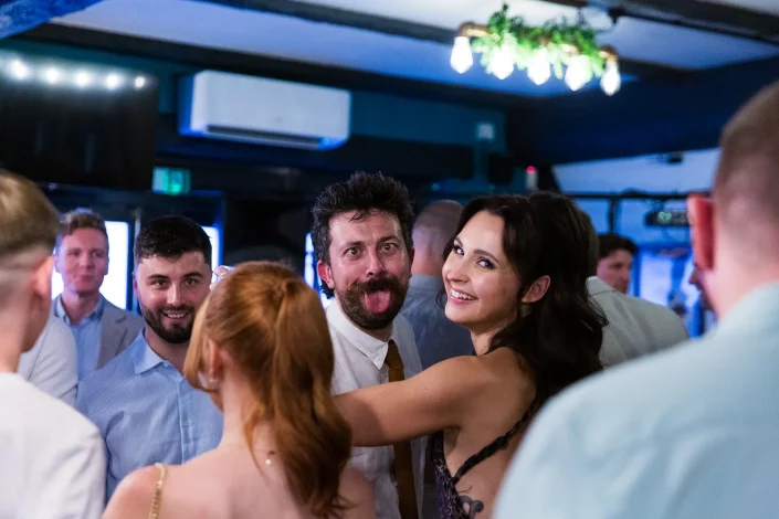 wedding reception guests dancing